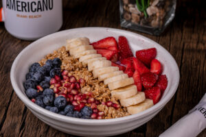 Granola bowl with fresh blueberries, strawberries and banana, a healthy breakfast South Beach option for the January detox menu at Cafe Americano